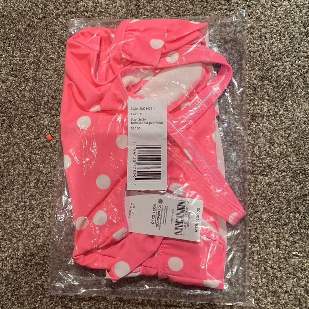 Pink polka dot toddler swimsuit